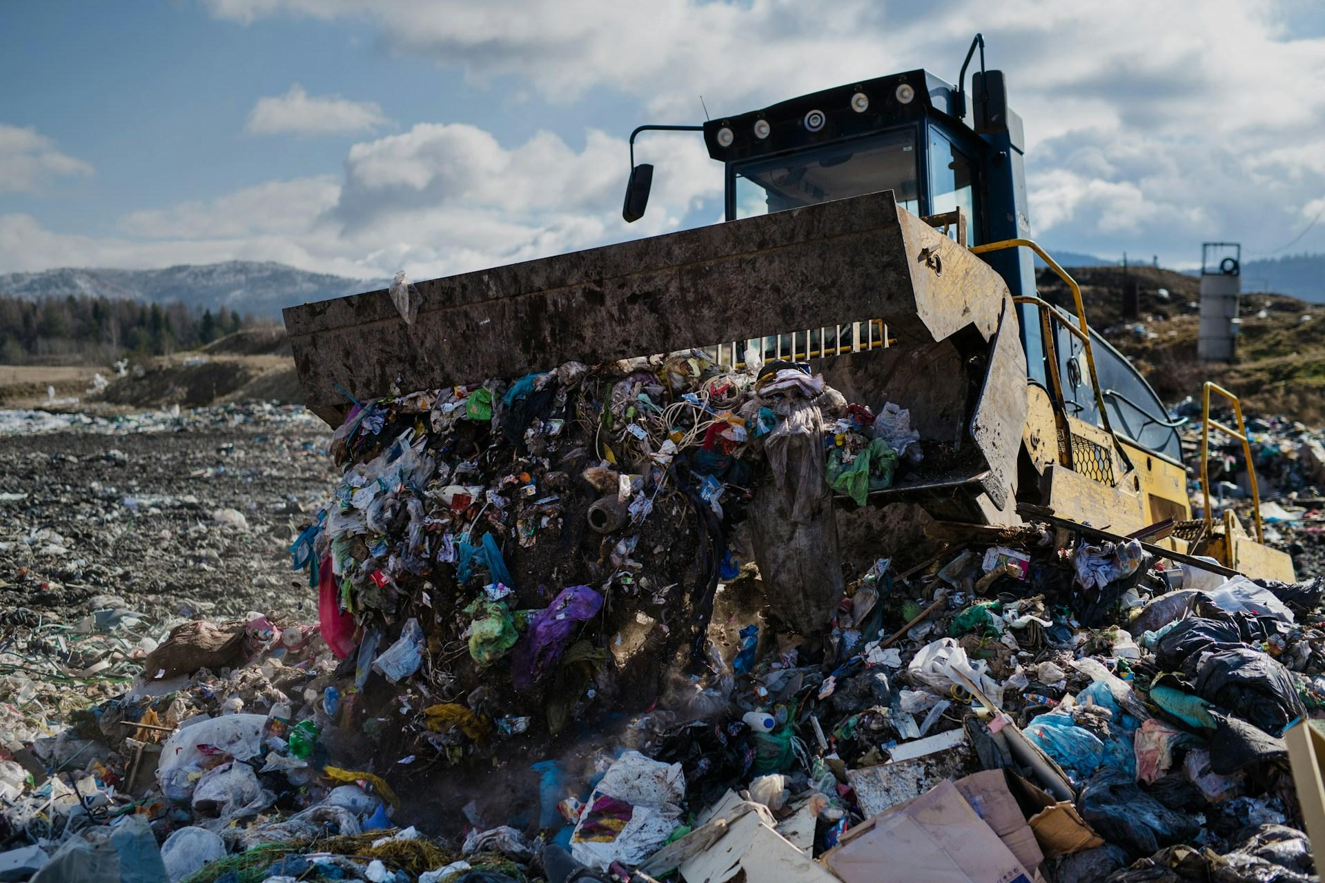 Bulldozer_pushing_waste_at_a_landfill